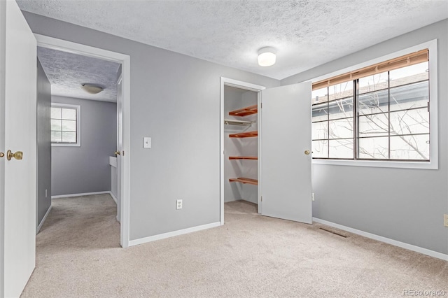 9328 Fenton Ct, Westminster, CO 80031 - unfurnished bedroom with a textured ceiling, carpet flooring, a spacious closet, and a closet