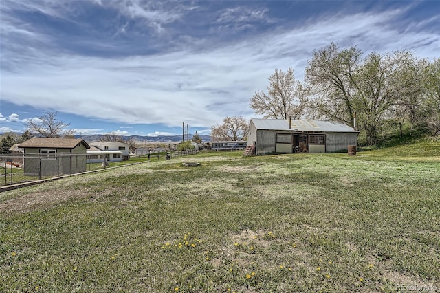 13805 W 82nd Ave, Arvada, CO 80005 - view of yard featuring fence and an outbuilding