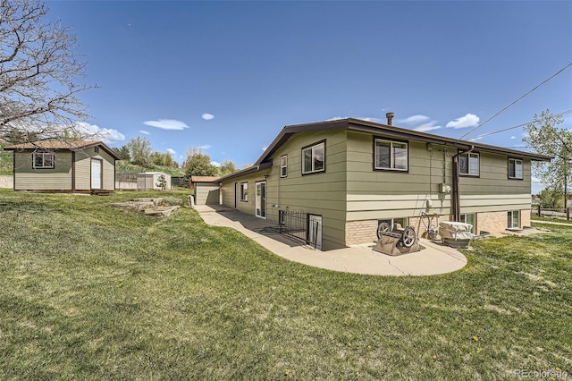13805 W 82nd Ave, Arvada, CO 80005 - back of property with an outdoor structure, a yard, a shed, and a patio