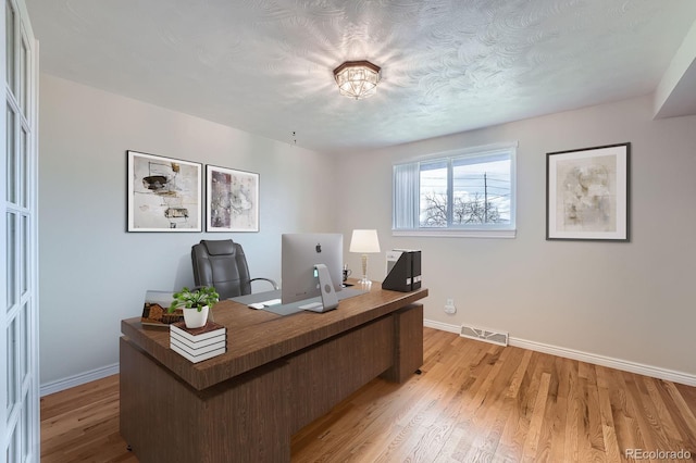 13805 W 82nd Ave, Arvada, CO 80005 - office area with baseboards, light wood-type flooring, and visible vents