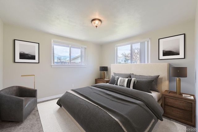 13805 W 82nd Ave, Arvada, CO 80005 - carpeted bedroom with baseboards and multiple windows