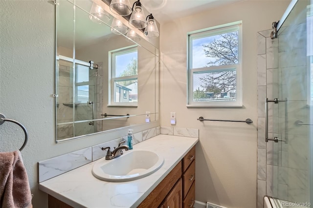 13805 W 82nd Ave, Arvada, CO 80005 - bathroom featuring vanity and tiled shower