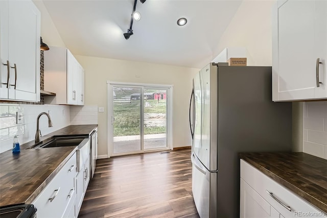 13805 W 82nd Ave, Arvada, CO 80005 - kitchen featuring butcher block counters, freestanding refrigerator, dark wood-type flooring, black range oven, and white cabinets