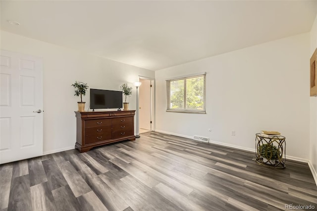 1477 S Wright St, Lakewood, CO 80228 - unfurnished bedroom featuring dark wood finished floors and baseboards