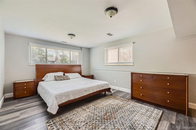 1477 S Wright St, Lakewood, CO 80228 - bedroom featuring wood finished floors and baseboards