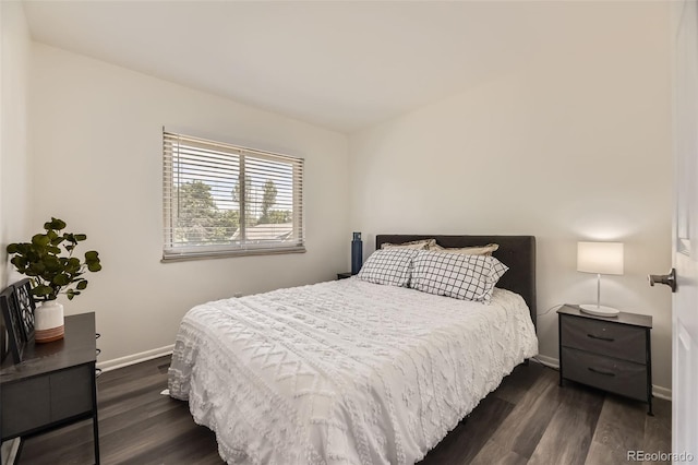 1477 S Wright St, Lakewood, CO 80228 - bedroom featuring dark wood-style flooring and baseboards