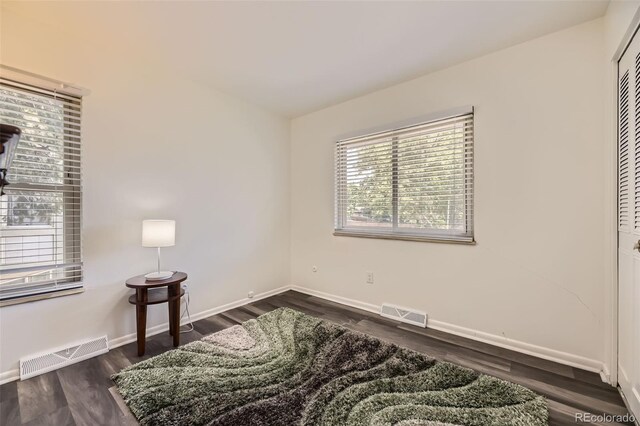 1477 S Wright St, Lakewood, CO 80228 - bedroom featuring dark wood-type flooring, baseboards, and a closet