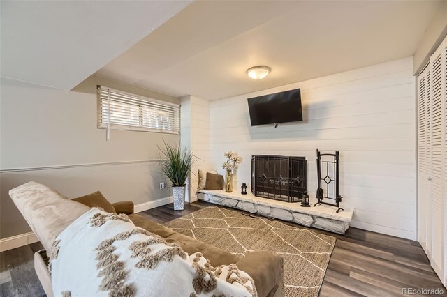1477 S Wright St, Lakewood, CO 80228 - living area with wood finished floors, a fireplace with raised hearth, and baseboards
