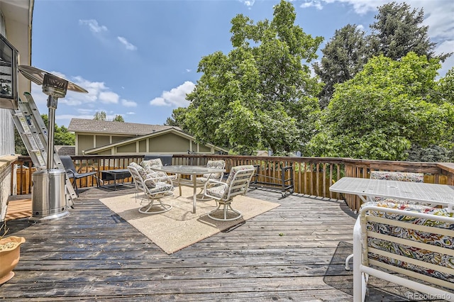 1477 S Wright St, Lakewood, CO 80228 - wooden terrace featuring outdoor dining space