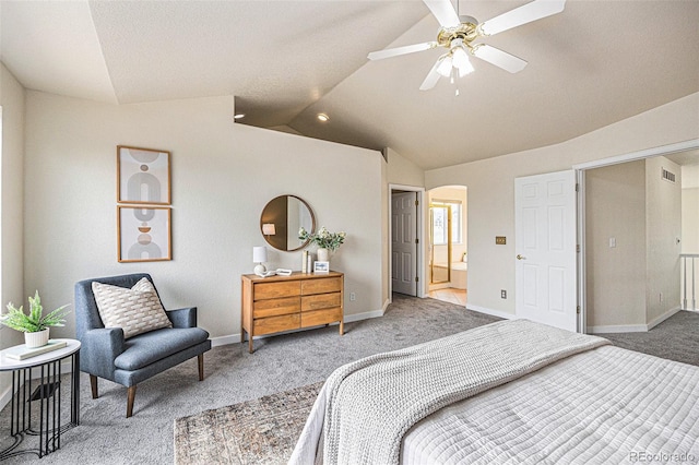 carpeted bedroom featuring baseboards, visible vents, arched walkways, connected bathroom, and lofted ceiling