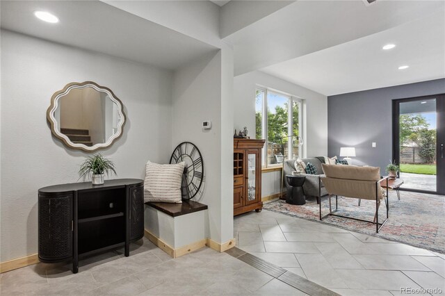 hallway featuring light tile patterned floors