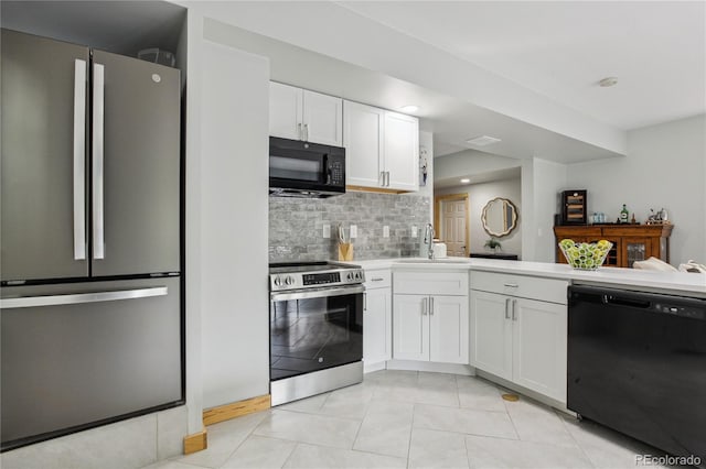 kitchen with sink, white cabinets, backsplash, light tile patterned floors, and black appliances