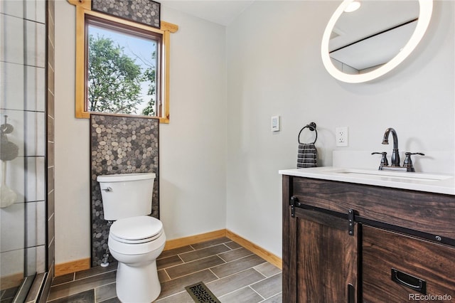 bathroom with vanity and toilet