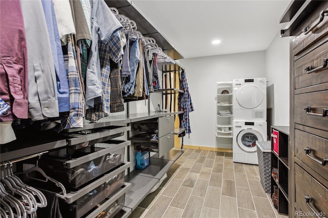 walk in closet featuring stacked washer / dryer