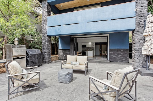 view of patio / terrace featuring an outdoor living space and grilling area