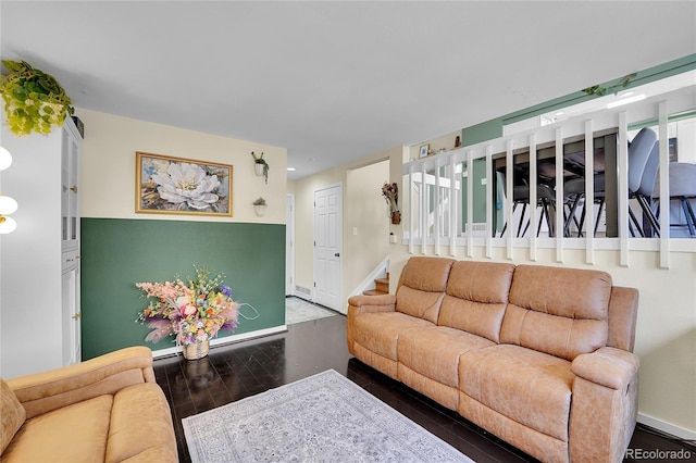 living room featuring stairs, wood finished floors, baseboards, and recessed lighting