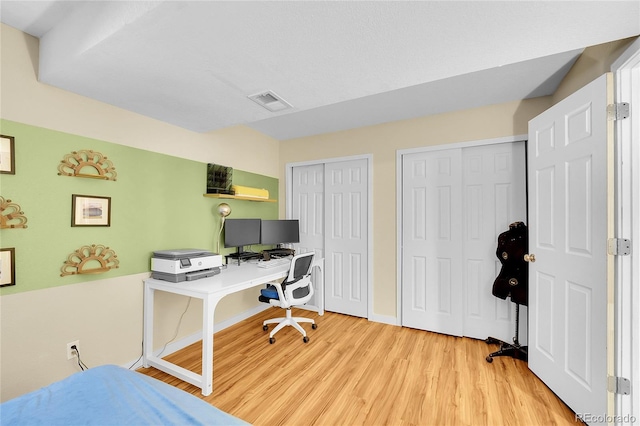 home office featuring light wood finished floors and baseboards