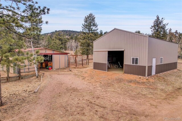 64 Elk Horn Ct, Bailey, CO 80421 - view of pole building with fence