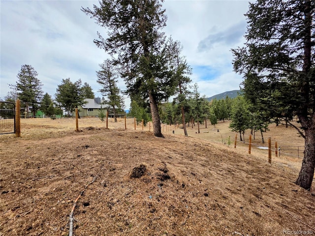 64 Elk Horn Ct, Bailey, CO 80421 - view of yard with a mountain view, fence, and a rural view