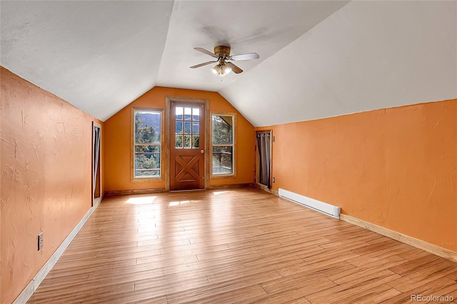 64 Elk Horn Ct, Bailey, CO 80421 - additional living space featuring lofted ceiling, ceiling fan, light wood-style flooring, and a baseboard radiator