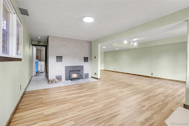 64 Elk Horn Ct, Bailey, CO 80421 - unfurnished living room featuring baseboards, visible vents, and wood finished floors