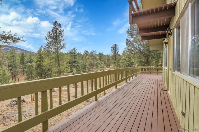 64 Elk Horn Ct, Bailey, CO 80421 - wooden deck with a wooded view
