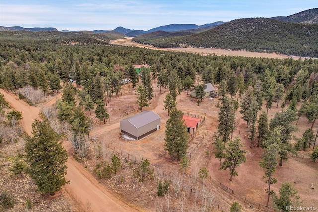 64 Elk Horn Ct, Bailey, CO 80421 - birds eye view of property with a forest view and a mountain view