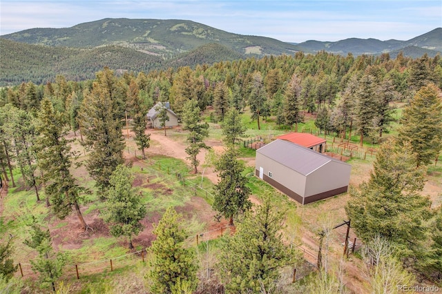 64 Elk Horn Ct, Bailey, CO 80421 - aerial view of property and surrounding area with a mountainous background and a heavily wooded area