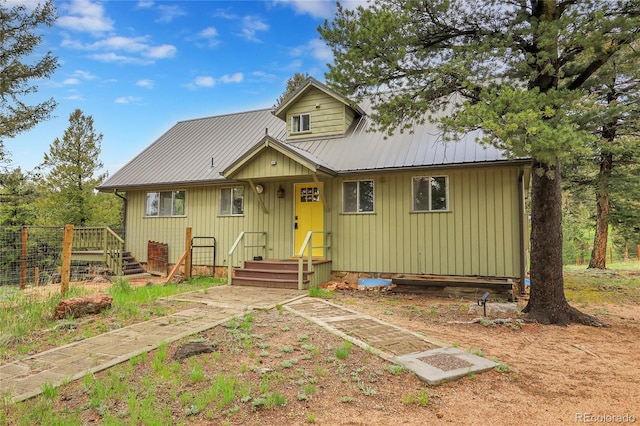 64 Elk Horn Ct, Bailey, CO 80421 - chalet / cabin featuring metal roof and board and batten siding