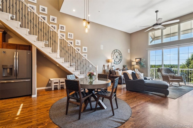 248 Writers Way, Colorado Springs, CO 80903 - dining area featuring a towering ceiling, stairs, dark wood-style flooring, ceiling fan, and recessed lighting