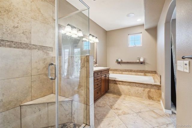 248 Writers Way, Colorado Springs, CO 80903 - full bathroom featuring vanity, a garden tub, a shower stall, and tile patterned floors