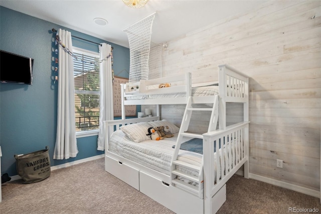 248 Writers Way, Colorado Springs, CO 80903 - bedroom featuring carpet flooring, multiple windows, and wooden walls