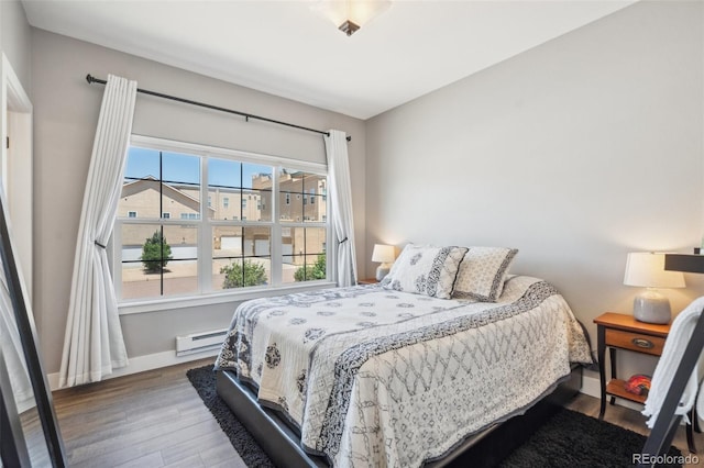248 Writers Way, Colorado Springs, CO 80903 - bedroom featuring a baseboard heating unit and wood finished floors