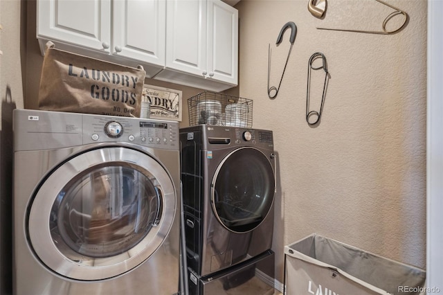 248 Writers Way, Colorado Springs, CO 80903 - laundry room featuring cabinet space, washer and clothes dryer, and a textured wall