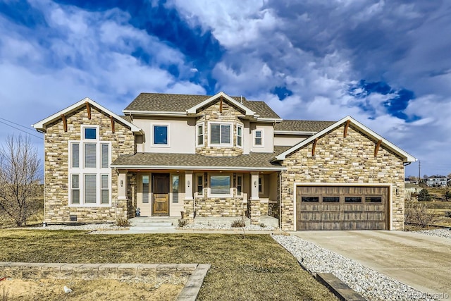 craftsman inspired home featuring a garage and covered porch