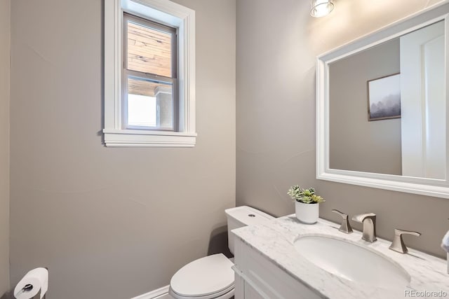 bathroom featuring toilet and vanity