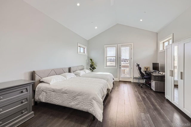 bedroom with vaulted ceiling and dark hardwood / wood-style flooring