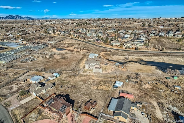 birds eye view of property with a mountain view