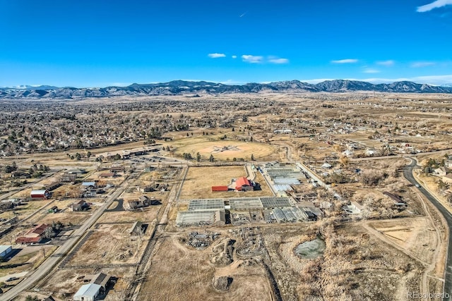 birds eye view of property featuring a mountain view