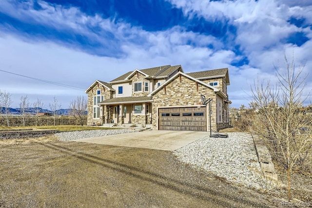 view of front of house featuring a porch and a garage