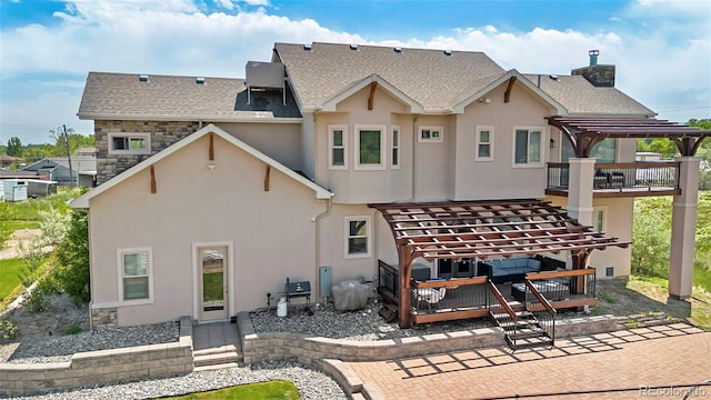 7587 Wright Ct, Arvada, CO 80005 - rear view of property featuring a wooden deck, a pergola, stucco siding, and a chimney