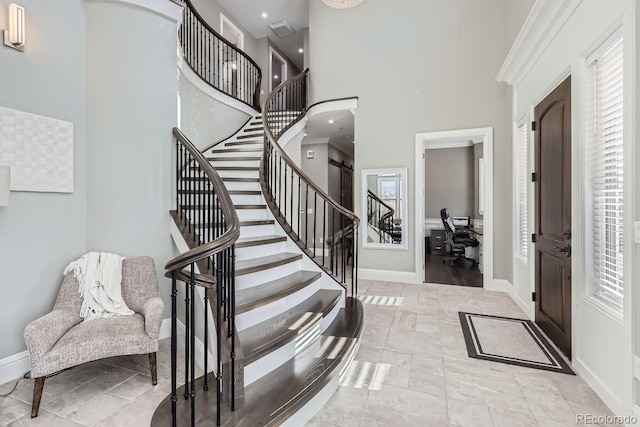 7587 Wright Ct, Arvada, CO 80005 - foyer with stairway, a high ceiling, and baseboards