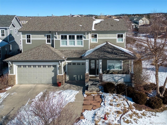 front of property with a garage and covered porch