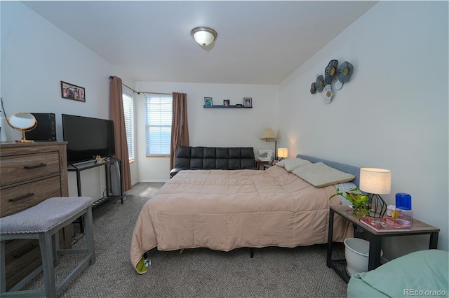 bedroom with carpet flooring and baseboards