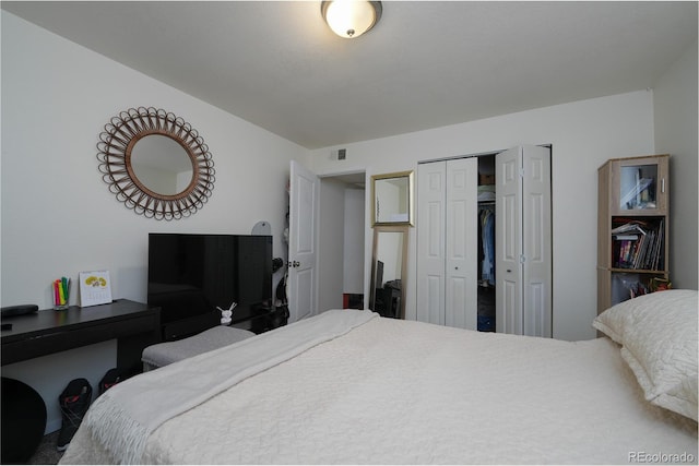 bedroom featuring a closet and visible vents