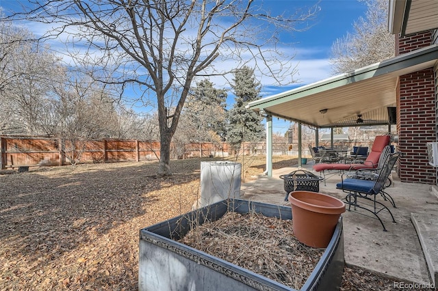 view of patio / terrace with an outdoor fire pit