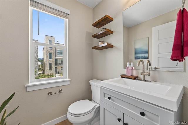 5396 Quail St, Wheat Ridge, CO 80033 - bathroom with toilet and vanity