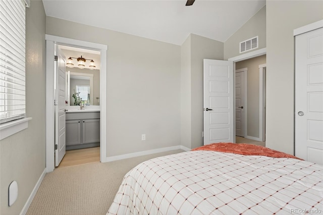 5396 Quail St, Wheat Ridge, CO 80033 - bedroom featuring light colored carpet, lofted ceiling, ensuite bathroom, and ceiling fan