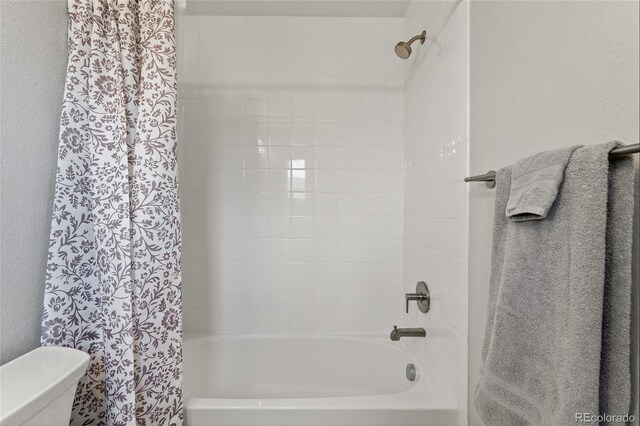 5396 Quail St, Wheat Ridge, CO 80033 - full bathroom featuring shower / bathtub combination with curtain and toilet