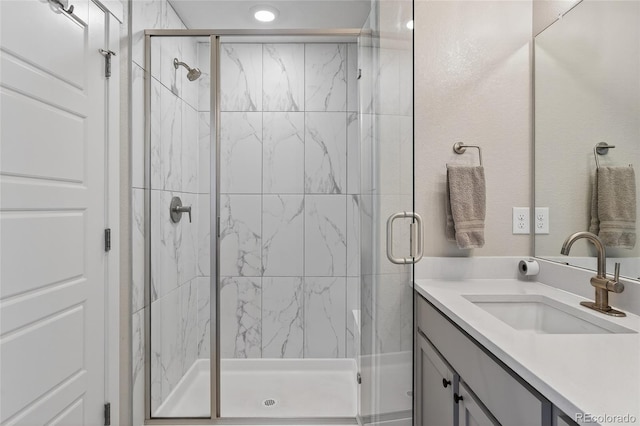 5396 Quail St, Wheat Ridge, CO 80033 - bathroom featuring vanity and a marble finish shower